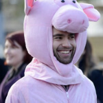 nauras photographed portrait in a pig costume